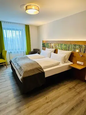 Ein Bett oder Betten in einem Zimmer der Unterkunft Landgasthof Linden