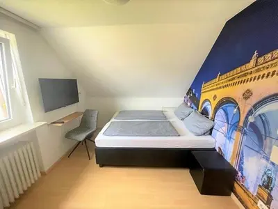 Ein Bett oder Betten in einem Zimmer der Unterkunft Olympia Pension