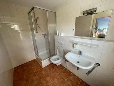Ein Badezimmer in der Unterkunft Olympia Pension