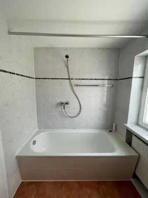 Ein Badezimmer in der Unterkunft Olympia Pension