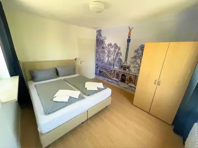 Ein Bett oder Betten in einem Zimmer der Unterkunft Olympia Pension