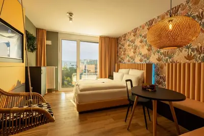 Ein Bett oder Betten in einem Zimmer der Unterkunft Rioca Munich Posto 3