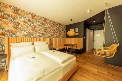 Ein Bett oder Betten in einem Zimmer der Unterkunft Rioca Munich Posto 3