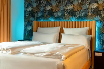 Ein Bett oder Betten in einem Zimmer der Unterkunft Rioca Munich Posto 3
