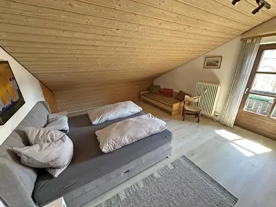 Ein Bett oder Betten in einem Zimmer der Unterkunft Ferienwohnung Haus Kampenwand Löhr