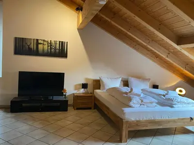 Ein Bett oder Betten in einem Zimmer der Unterkunft Ferienwohnung Hubertus
