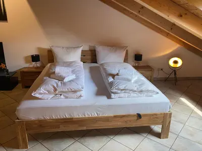 Ein Bett oder Betten in einem Zimmer der Unterkunft Ferienwohnung Hubertus