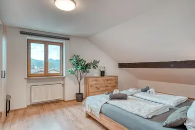 Ein Bett oder Betten in einem Zimmer der Unterkunft Urlaub im Inntal Ferienwohnung Brünnstein