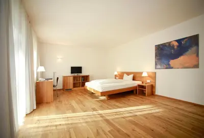 Ein Bett oder Betten in einem Zimmer der Unterkunft B&O Parkhotel
