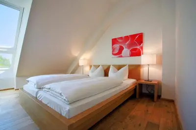 Ein Bett oder Betten in einem Zimmer der Unterkunft B&O Parkhotel