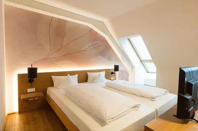 Ein Bett oder Betten in einem Zimmer der Unterkunft B&O Parkhotel
