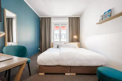 Ein Bett oder Betten in einem Zimmer der Unterkunft Hotel Stachus