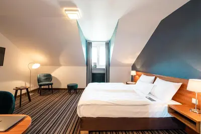 Ein Bett oder Betten in einem Zimmer der Unterkunft Hotel Stachus