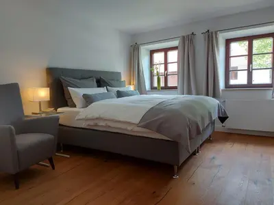 Ein Bett oder Betten in einem Zimmer der Unterkunft Marxhof Seebruck am Chiemsee