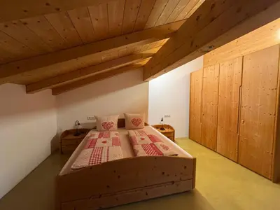Ein Bett oder Betten in einem Zimmer der Unterkunft Ferienwohnungen Kieferbachtal