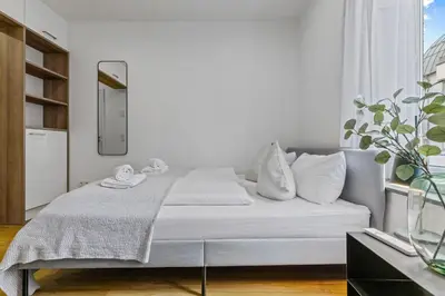 Ein Bett oder Betten in einem Zimmer der Unterkunft ma suite - Augsburg City