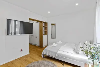 Ein Bett oder Betten in einem Zimmer der Unterkunft ma suite - Augsburg City