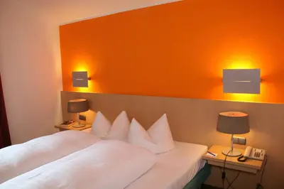 Ein Bett oder Betten in einem Zimmer der Unterkunft Hotel Schloss Berg