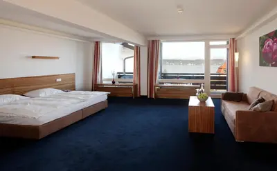 Ein Bett oder Betten in einem Zimmer der Unterkunft Hotel Schloss Berg