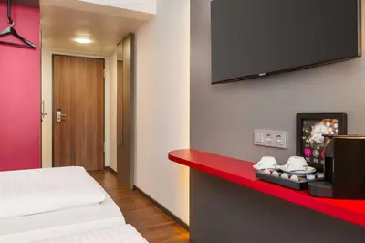 Ein Bett oder Betten in einem Zimmer der Unterkunft Amedia Munich Dachau, Trademark Collection by Wyndham