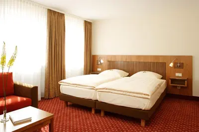 Ein Bett oder Betten in einem Zimmer der Unterkunft Hotel Landgasthof Gschwendtner