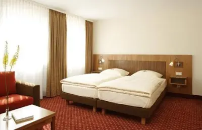Ein Bett oder Betten in einem Zimmer der Unterkunft Hotel Landgasthof Gschwendtner