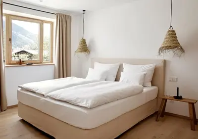 Ein Bett oder Betten in einem Zimmer der Unterkunft Der Schmiedhof