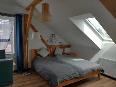 Ein Bett oder Betten in einem Zimmer der Unterkunft Bad Aibling City Apartment DG