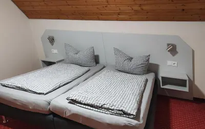 Ein Bett oder Betten in einem Zimmer der Unterkunft Pension Schneider, Ferienwohnung