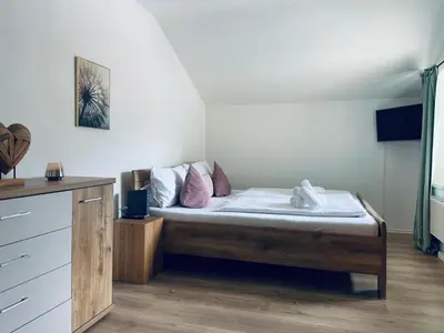 Ein Bett oder Betten in einem Zimmer der Unterkunft Süßes Studio mit Bergblick