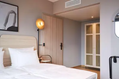 Ein Bett oder Betten in einem Zimmer der Unterkunft Scandic München Macherei
