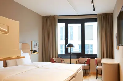 Ein Bett oder Betten in einem Zimmer der Unterkunft Scandic München Macherei