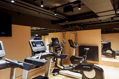 Das Fitnesscenter und/oder die Fitnesseinrichtungen in der Unterkunft Scandic München Macherei