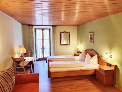 Ein Bett oder Betten in einem Zimmer der Unterkunft Hotel Altwirt