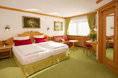 Ein Bett oder Betten in einem Zimmer der Unterkunft Park Hotel Laim