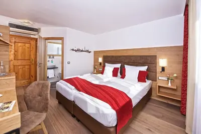 Ein Bett oder Betten in einem Zimmer der Unterkunft Park Hotel Laim