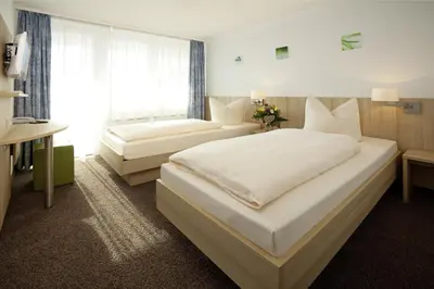 Ein Bett oder Betten in einem Zimmer der Unterkunft Gasthof Lerner