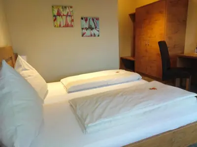 Ein Bett oder Betten in einem Zimmer der Unterkunft Hotel Daimerwirt