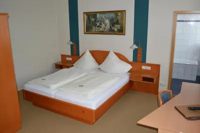 Ein Bett oder Betten in einem Zimmer der Unterkunft Hotel Daimerwirt