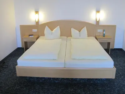 Ein Bett oder Betten in einem Zimmer der Unterkunft Hotel Jagermo
