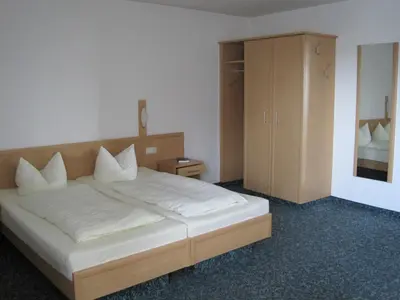 Ein Bett oder Betten in einem Zimmer der Unterkunft Hotel Jagermo
