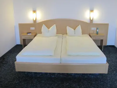 Ein Bett oder Betten in einem Zimmer der Unterkunft Hotel Jagermo