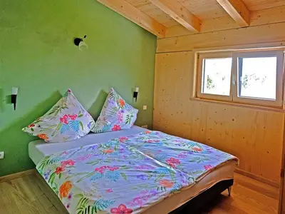 Ein Bett oder Betten in einem Zimmer der Unterkunft Ferienwohnung Schöpf