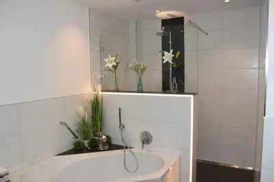 Ein Badezimmer in der Unterkunft Top-Moderne und geräumige Ferienwohnung