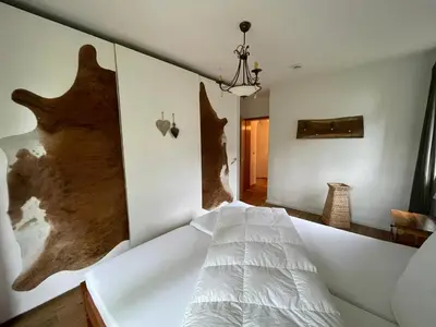 Ein Bett oder Betten in einem Zimmer der Unterkunft Ferienwohnung mit Herz Seebruck am Chiemsee