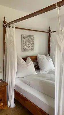 Ein Bett oder Betten in einem Zimmer der Unterkunft Ferienwohnung mit Herz Seebruck am Chiemsee
