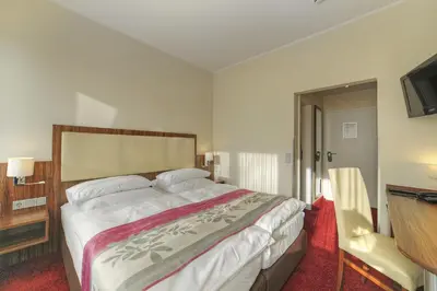 Ein Bett oder Betten in einem Zimmer der Unterkunft Hotel Da Vinci