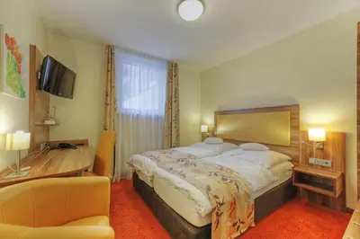 Ein Bett oder Betten in einem Zimmer der Unterkunft Hotel Da Vinci