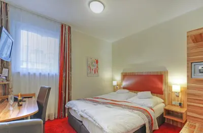 Ein Bett oder Betten in einem Zimmer der Unterkunft Hotel Da Vinci