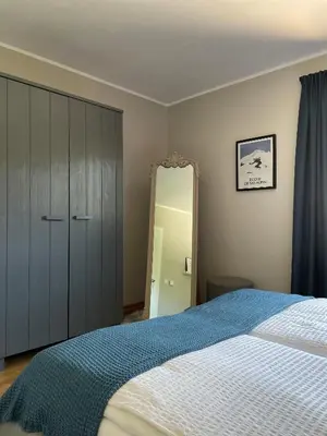 Ein Bett oder Betten in einem Zimmer der Unterkunft Das Bergquartier - Ferienwohnung Rabenkopf